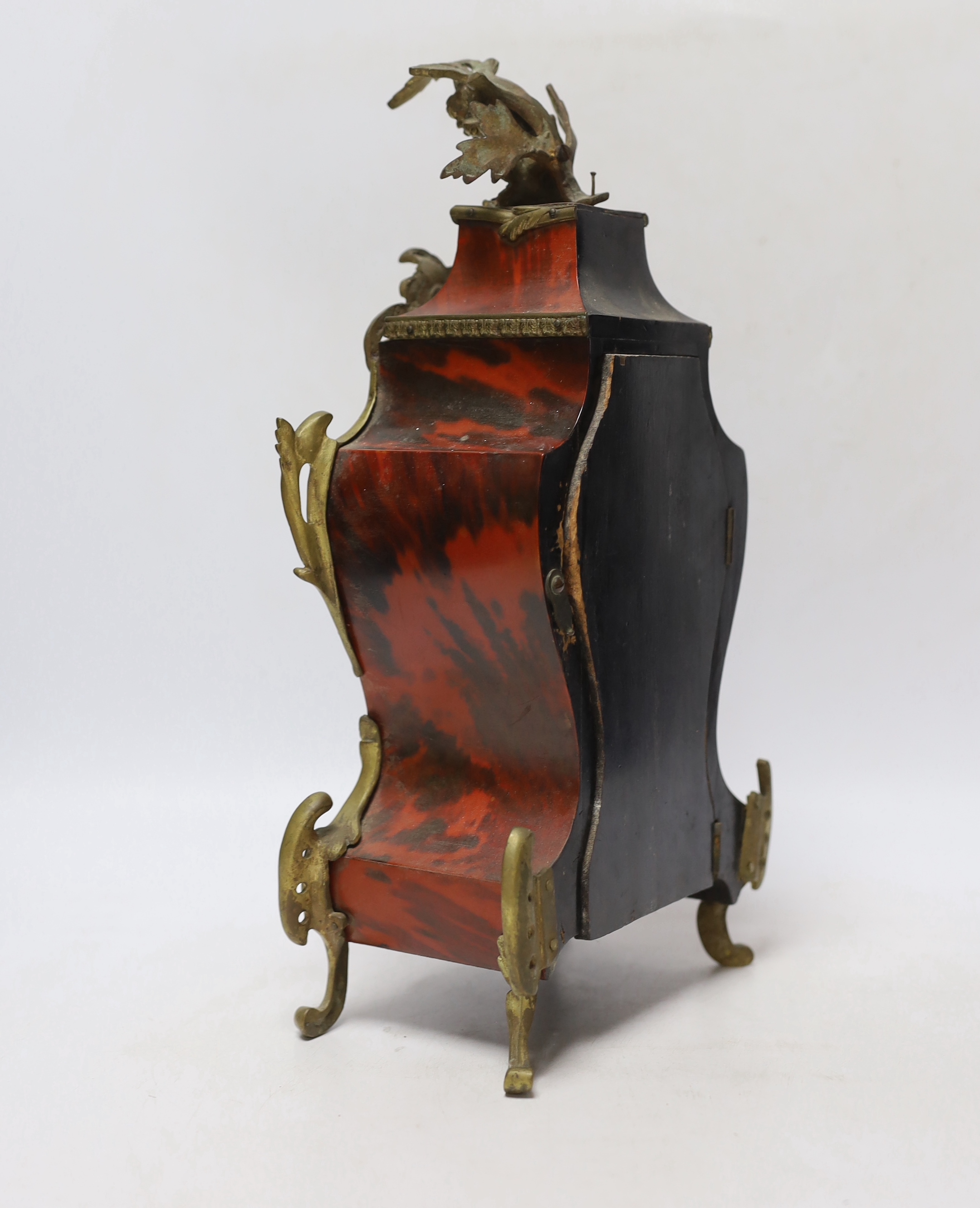 A late 19th century Louis XV style eight day red tortoiseshell and gilt metal cased mantel clock, 34cm high
